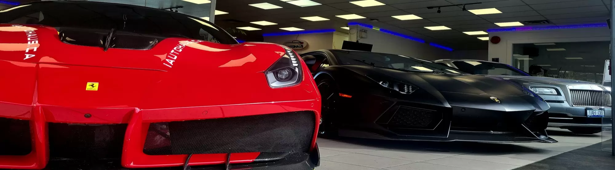 I AUTOHAUS showroom — Ferrari, Lamborghini, Rolls Royce